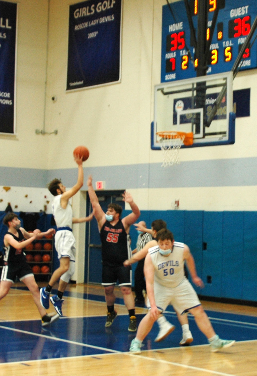 Anthony Teipelke rises up for a lay-up while trailing by one in the waning seconds of regulation against Tri-Valley. Although the shot did not fall, Teipelke was fouled on the play and scored the game-tying free throw with 2.2 seconds remaining.