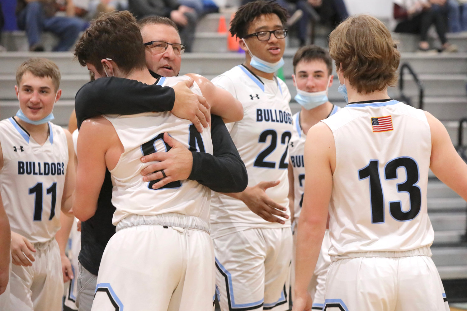 Then, the rite of passage.
Sullivan West Coach John Meyer hugs each of the seniors at the end of the Bulldogs last game on their home floor. Pictured here he is clasping Dylan Sager in one of the special moments after the win over the Bears.