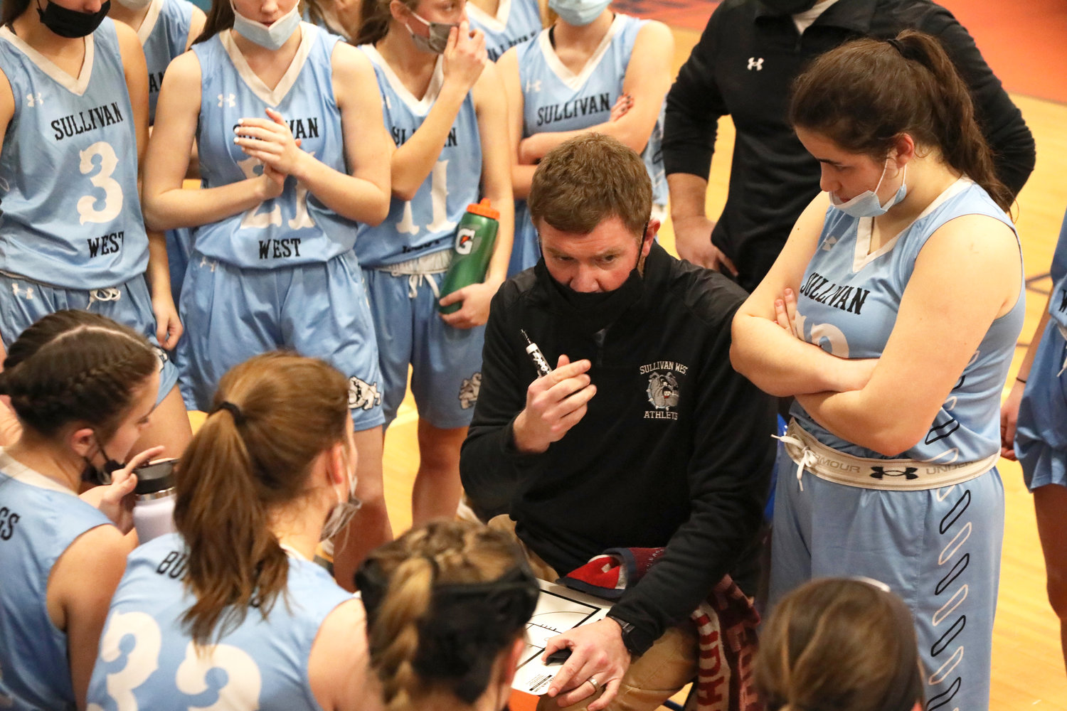 SW Coach Pat Donovan imparts strategy to his team during a time out. Donovan’s coaching this year was his best effort during his reign with arguably the best team under his watch to guide.