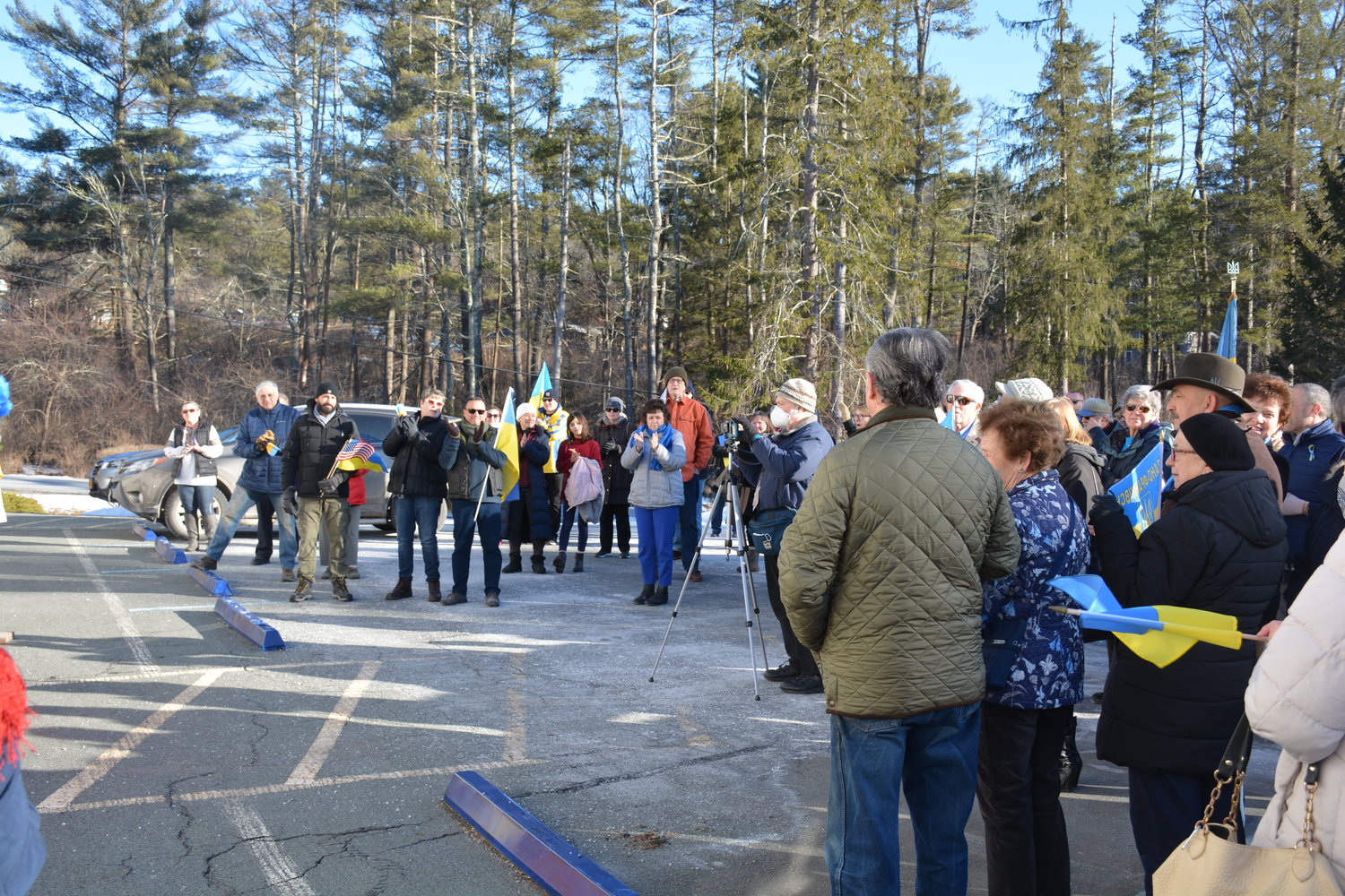 The Senior parking lot at the Lumberland Town Hall was packed with community members, as well as local and elected officials on Friday, wearing blue and yellow, and waving Ukrainian flags, to show support for the country currently at war with Russia.