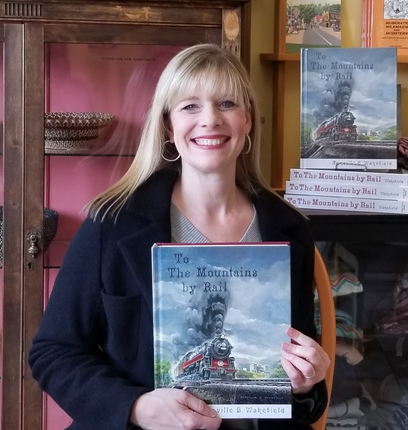 Denise Lombardi of the Hurleyville General Store with “To The Mountains by Rail.”