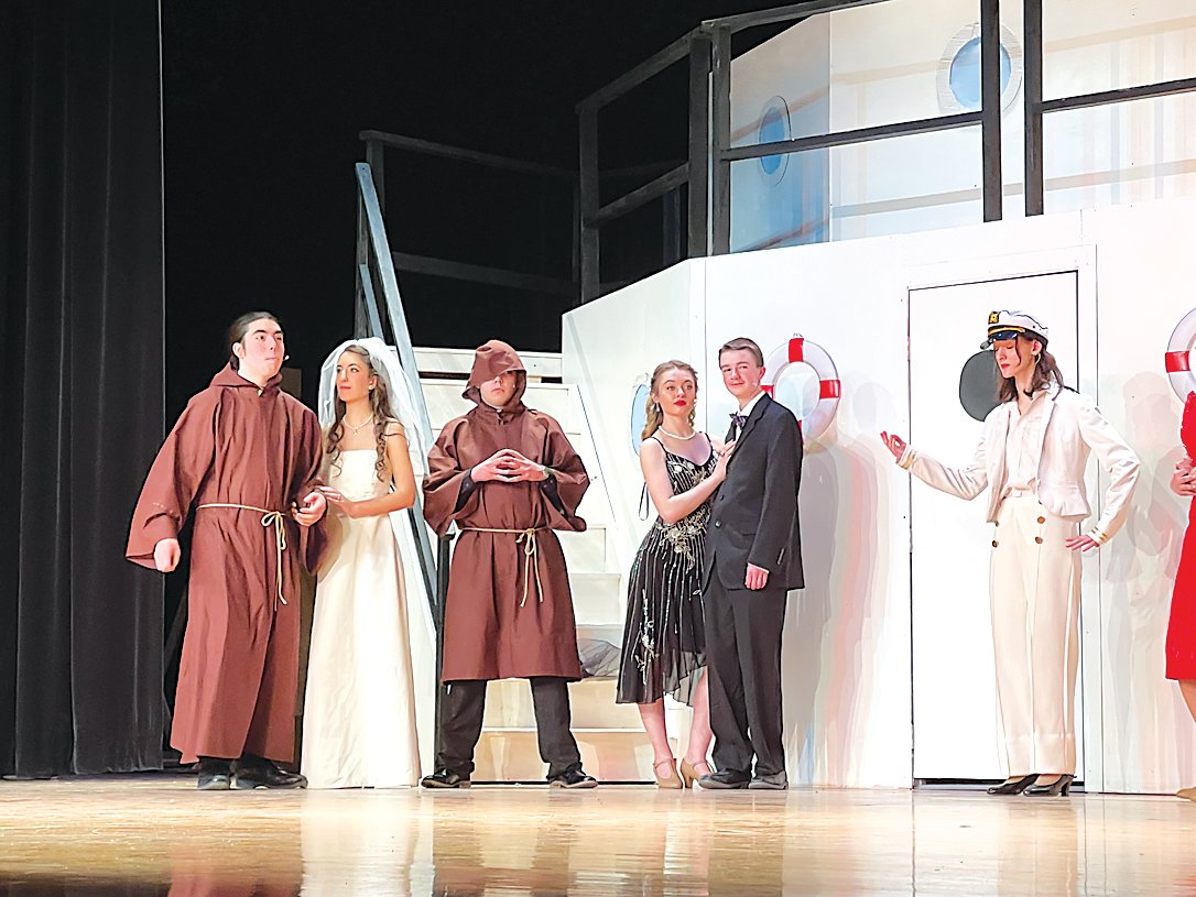 In one of the closing scenes, Billy Cocker (Henry Simon) and Moonface Martin (Charles Simon), both dressed in priest robes, go top deck as Billy finally gets the hand of his girl, Hope Harcourt, played by Angela Cordischi.