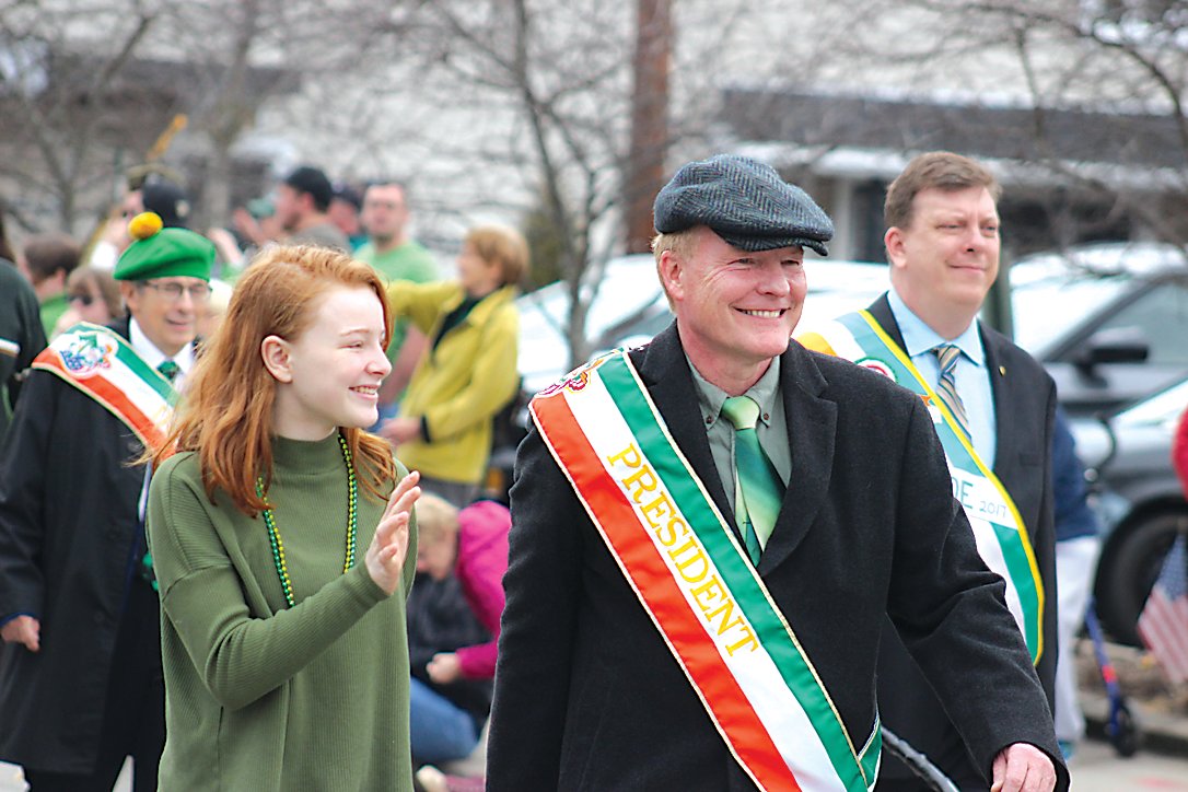 Ancient Order of Hibernians, Sullivan Brothers, Division One President Bill Moloney marches alongside granddaughter Rowan during Saturday’s parade.