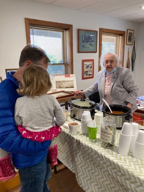 105-year-old Agnes Van Put dishes out her famous homemade soups at the CFFC Opening weekend festivities.