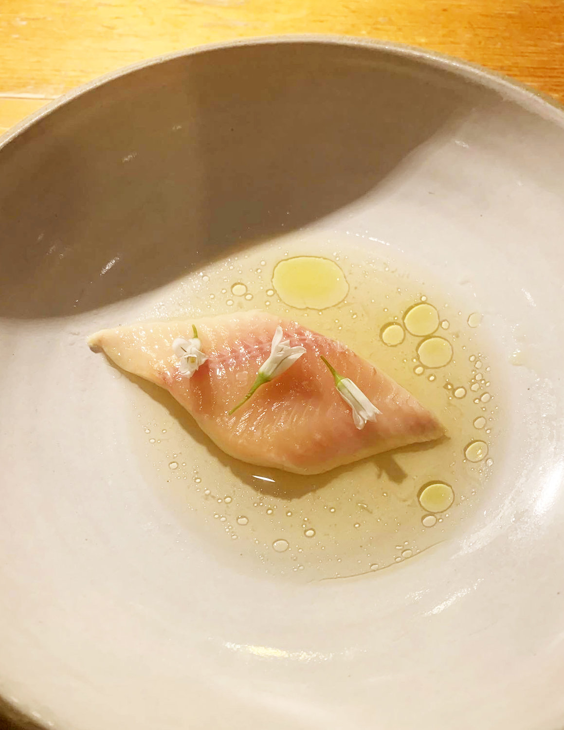 My favorite course of the night was  a crystal-clear smoked trout consommé, topped with delicate onion flowers.