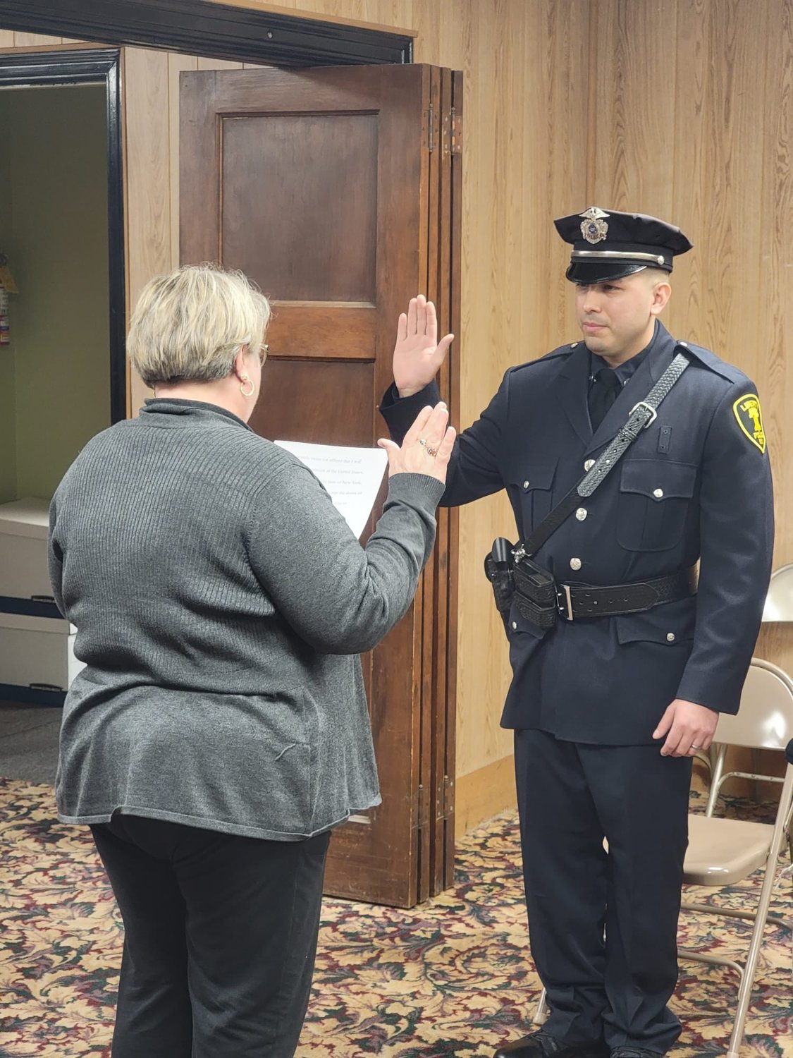 Village of Liberty Mayor Joan Stoddard administers the oath of office to Officer Anthony Ventura on Thursday last week.
