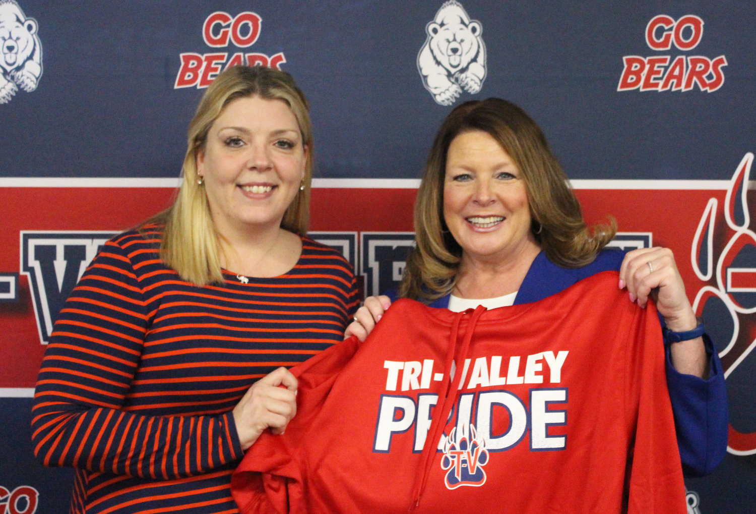 Tri-Valley Board of Education (BOE) President Keri Poley, left, presented incoming Superintendent Erin Long with some Bears gear following her appointment at this week’s BOE meeting.