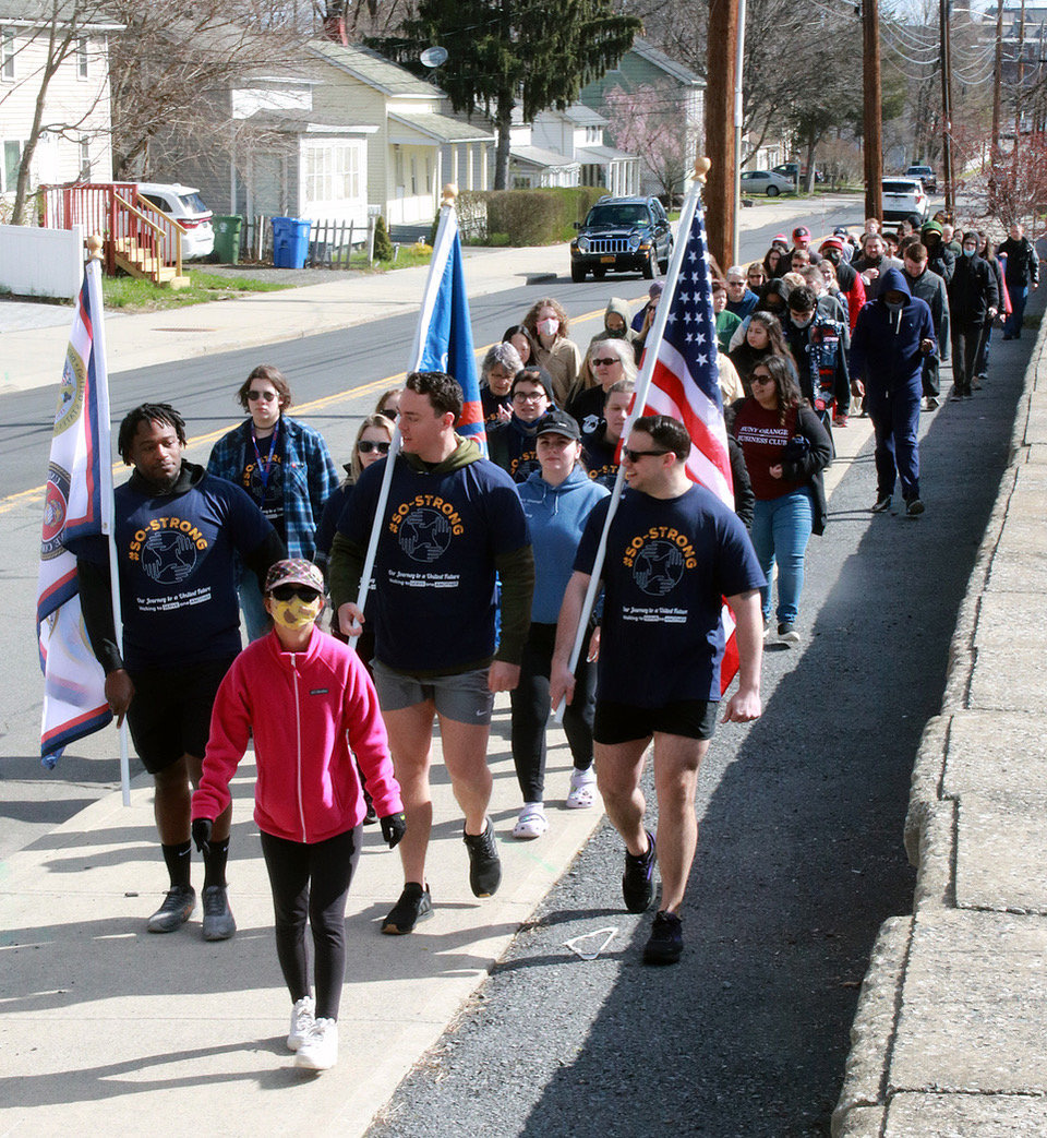 Labeled the #SOstrong Unity Walk, the event featured Veterans Club members carrying the American flag, the SUNY Orange flag, as well as a flag representing the various branches of the U.S. armed forces.