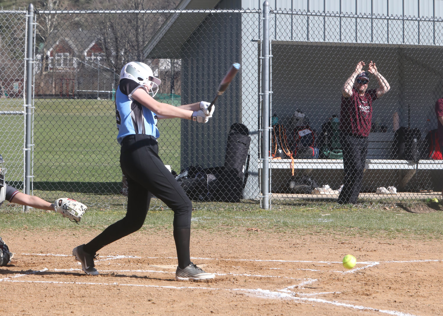 Elanie Herbert, a Sullivan West catcher, connects with a pitch in a non-league game against Livingston Manor.