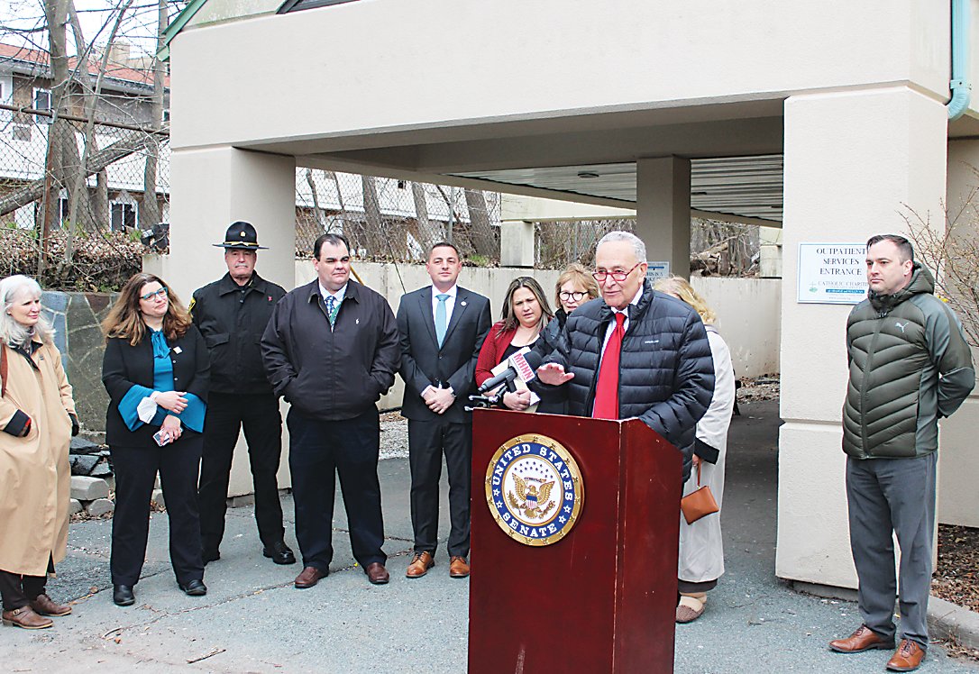 Joining Senator Chuck Schumer at Catholic Charities on Monday were (from left to right) County Treasurer Nancy Buck, Chief Executive Officer for Catholic Charities Shannon Kelly, Sheriff Michael Schiff, Legislature Chairman Rob Doherty, State Senator Mike Martucci, District Attorney Meagan Galligan, Assemblywoman Aileen Gunther, County Division of Health and Human Services Deputy Commissioner and Sullivan County Drug Task Force Co-Chair Wendy Brown and Sullivan County’s Division of Health and Human Services Commissioner John Liddle.