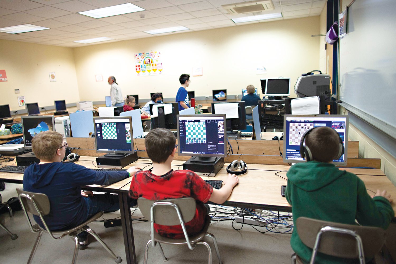 After playing over the board chess, the students then go to the computer to continue playing or solve chess puzzles.