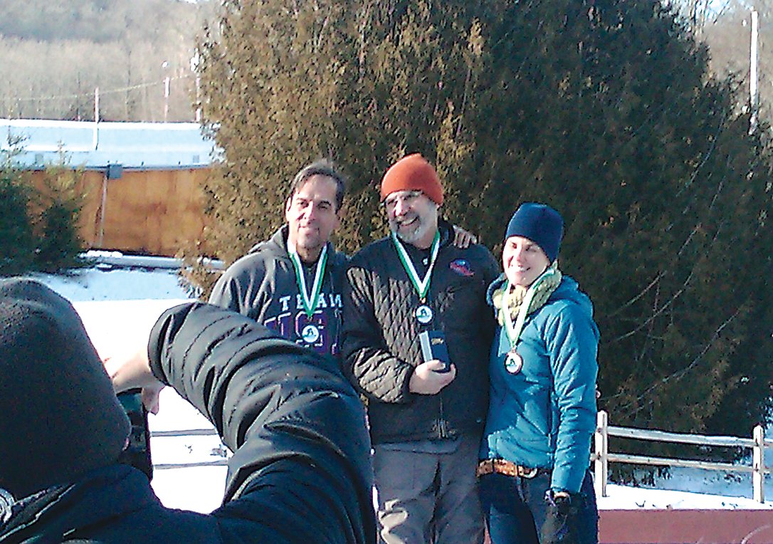 Simkin (center) took gold in Adult Class B at this Adirondack Luge Club Icebreaker Race in Lake Placid in 2013. He’s pictured with Anthony Shimkonis and Jennifer Elliott.