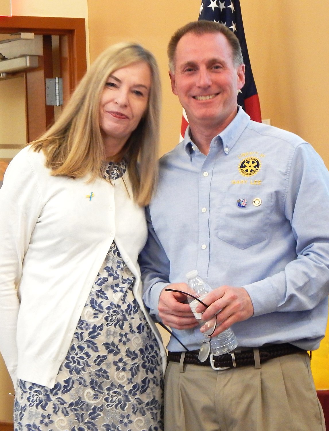 Liberty Rotary Club President Gary Silverman, right, presents Jannetta MacArthur with her Hummingbird Award.