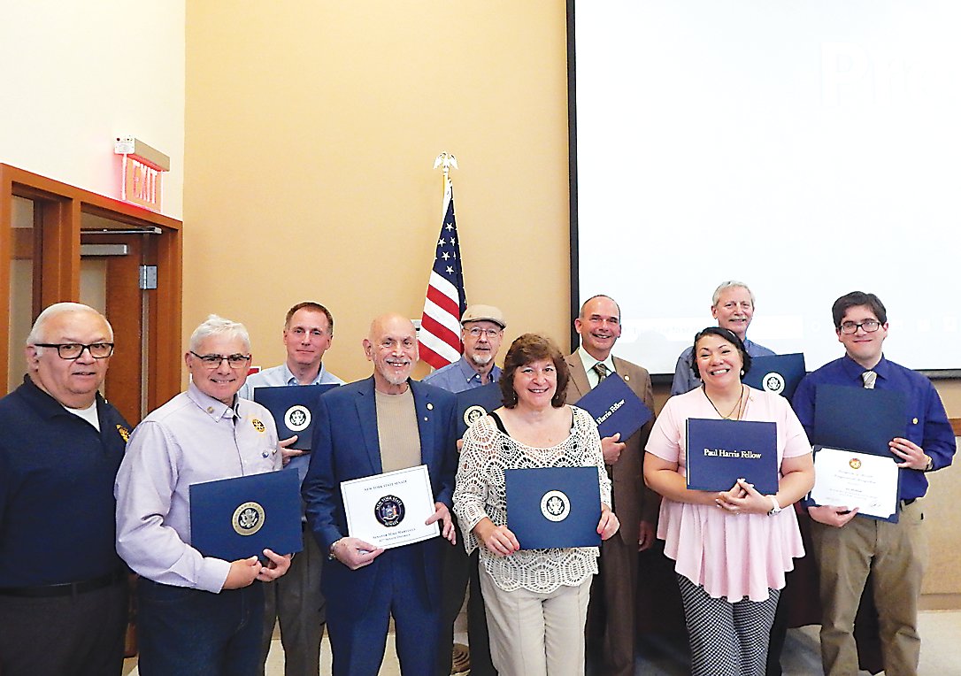 Paul Harris Fellows recognized at the event included, back row from left, Anthony Sinacore, Gary Silverman, Irving Kaplan, Danny Thalmann, and Gary Siegel. Front row, from left, Jack Strassman, Les Kristt, Judy Siegel, Joanna Gass and Joseph Abraham.