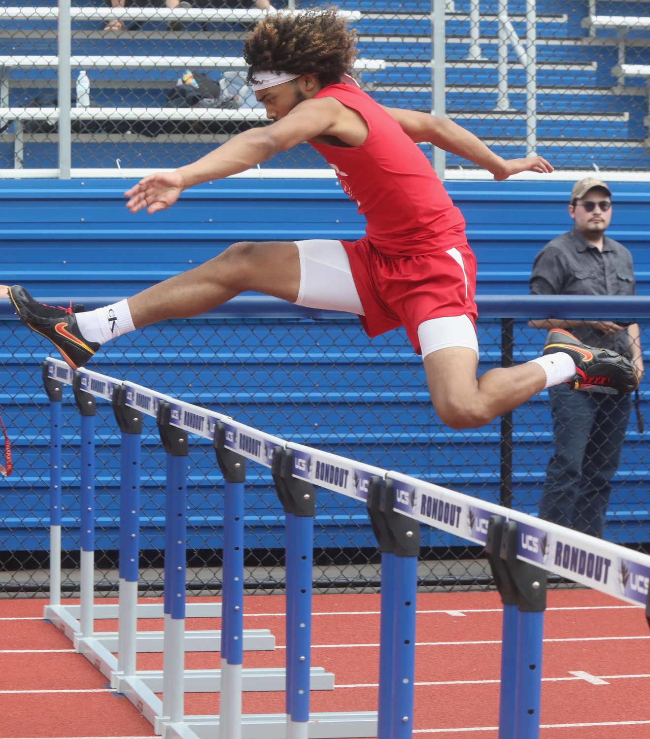 Liberty’s Shaun Coles shows great form as he finishes second in the 110 hurdles.