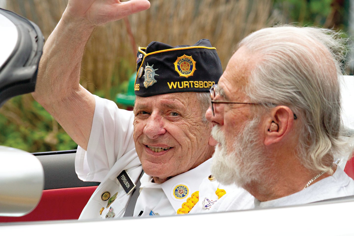 Grand Marshall of the parade, Tony Ferguson of the American Legion Post 1266, waved to the crowd during the Wurtsboro’s Memorial Day Parade while being driven by Jim Carney.