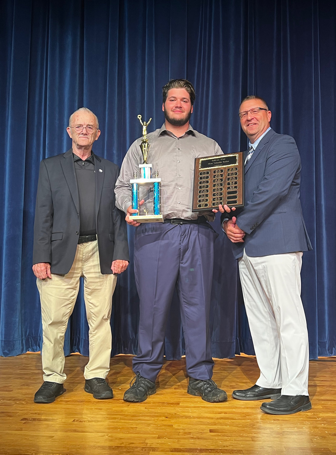 Chris Campanelli was named the spring male MVP. He is flanked by Coaches Ron Bauer and John Meyer.