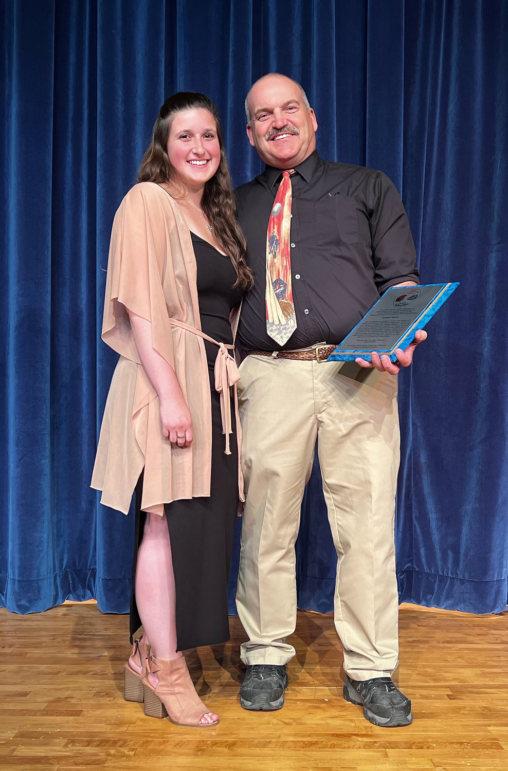Retiring coach Anthony Durkin was the honorary recipient of a plaque attesting to his decades of great coaching and service to the school and community. It was presented to him by his daughter Elaine.