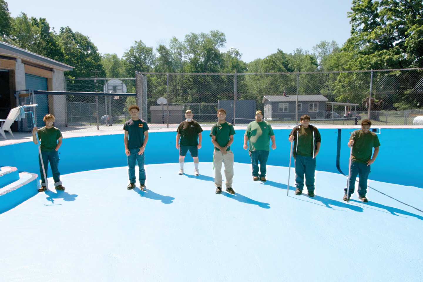 The Delaware Youth Center pool got a new paint job courtesy of (from left to right) Leo Chan, Emman Robinson, Facilities Coordinator Pete Lafleur, Jamir Craft-Diggs, Instructor Tom, Willemer Loja and Doile Peters.