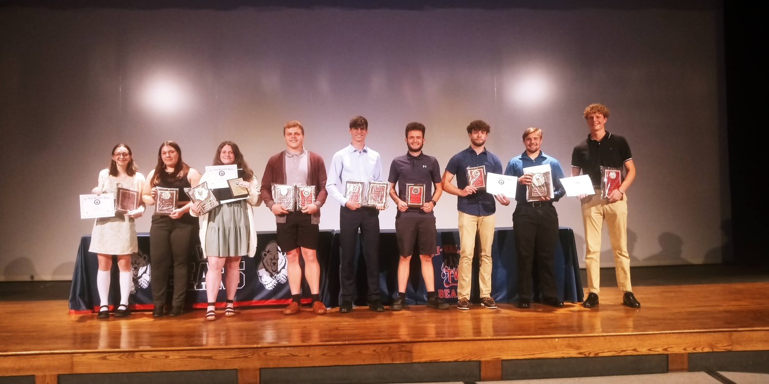 The Tri-Valley Senior Award recipients line up across the stage with their plaques and certificates that they earned from their successful sports careers.