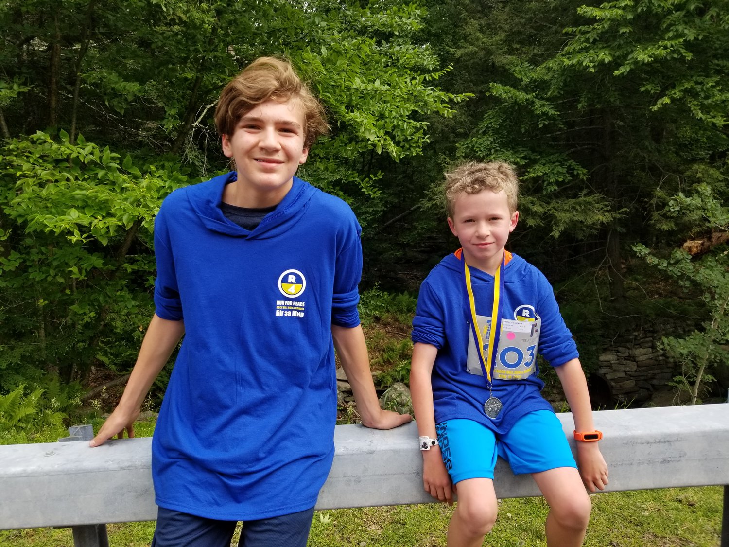Samuel Bolduc, 14, and Jackson Obermeyer, 8, neighbors, ran the race together for the first time.