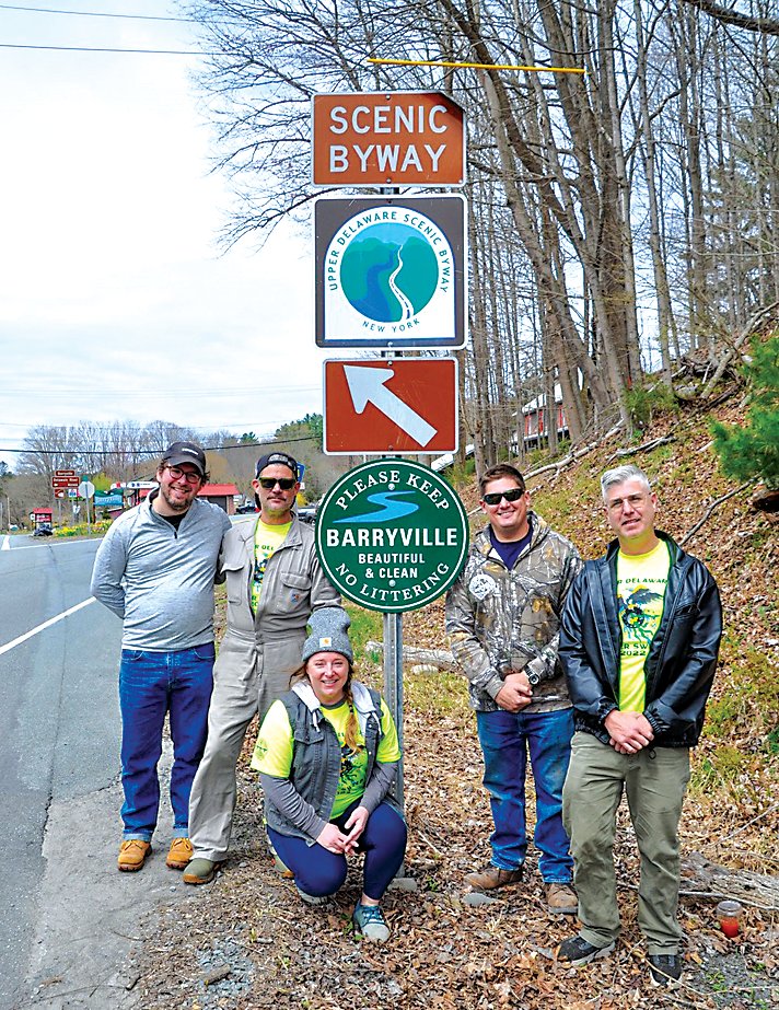 Helping to install new signs in Barryville recently were (from left) Pete Madden, Roswell Hamrick, Laura Burrell, Matt Sallusto, and John Pizzolato.