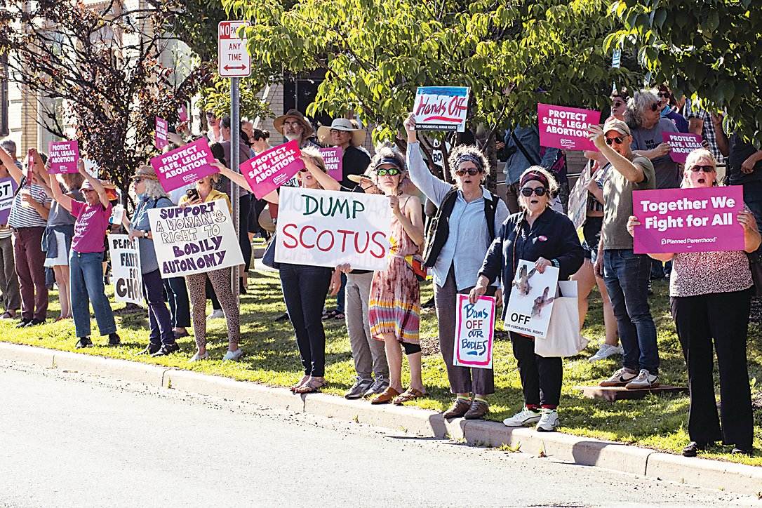 Dozens of protesters gathered along Broadway in Monticello on Friday after the Supreme Court of the United States issued a ruling that overturned Roe V. Wade.
