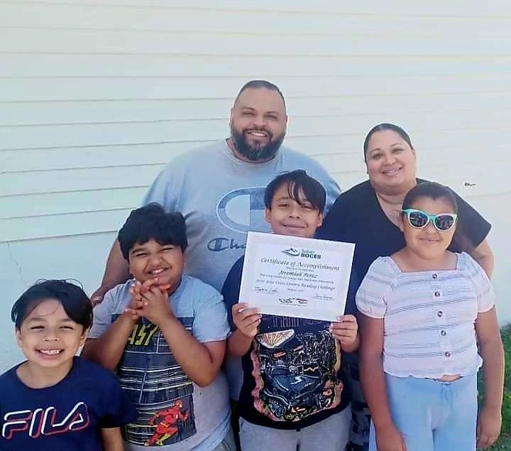 Pastor Charles Perez and his wife Jennie and their children Abraham, Josiah and daughter Serenity celebrate  their brother Jeremiah being awarded a Certificate of Accomplishment from Sullivan BOCES for being recognized as the top reader from the George Ross MacKenzie School in the 2021-2022 Cross County Reading Challenge. Congratulations to Jeremiah and the Perez family.