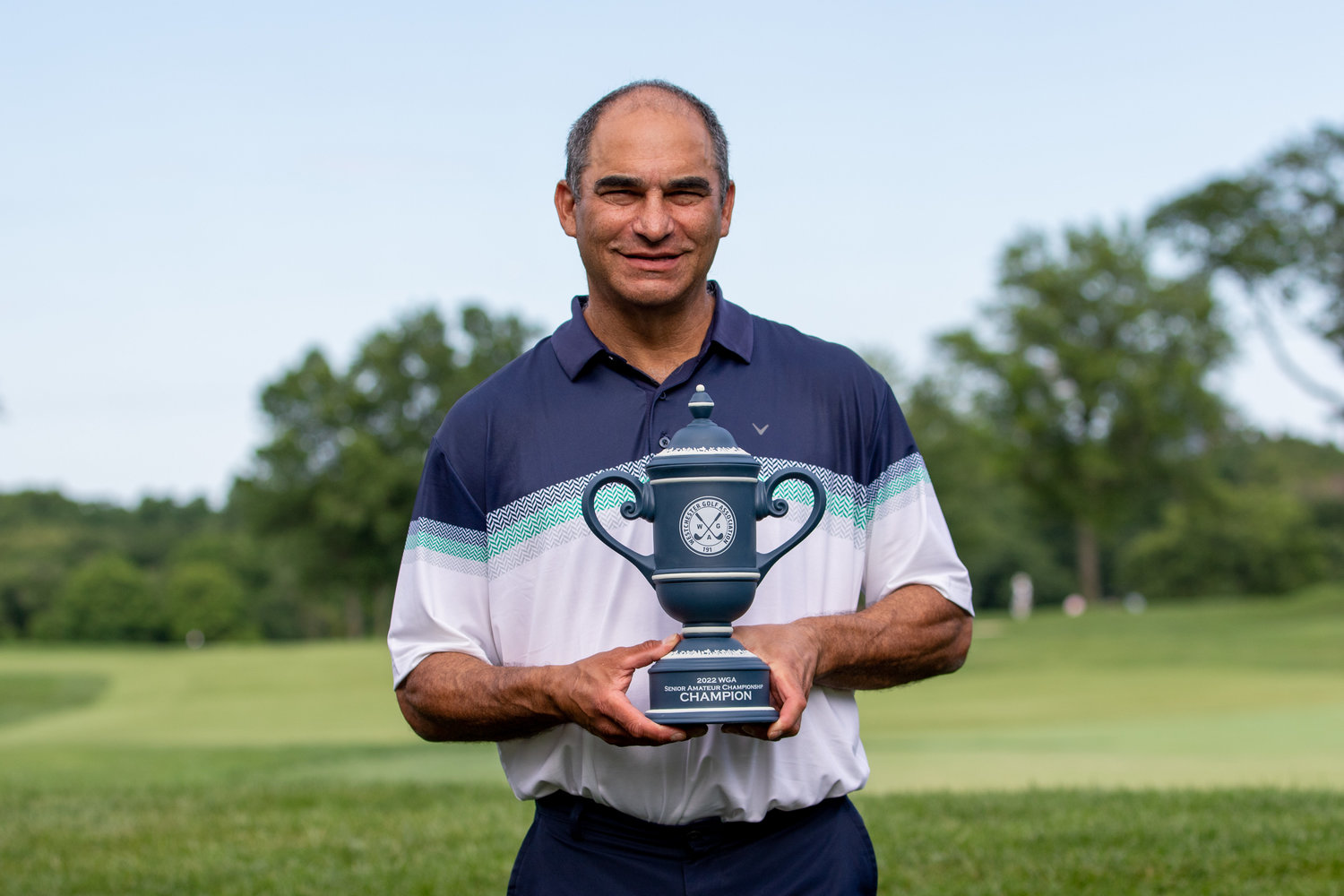 Ken Cohen proudly poses with the Westchester Senior Amateur Championship trophy.