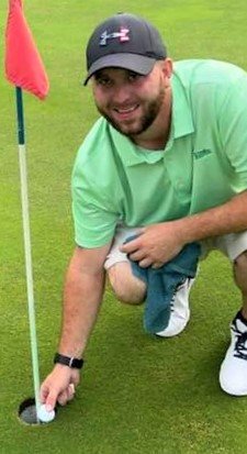 Thirty-year-old Liberty golfer Dean Winters retrieves his golf ball from the 17th hole at the Town of Fallsburg Tarry Brae Golf Course after scoring his second career ace witnessed  by fellow golfers Rodney T. Jester, Nick Price and Tyler Schmidt.