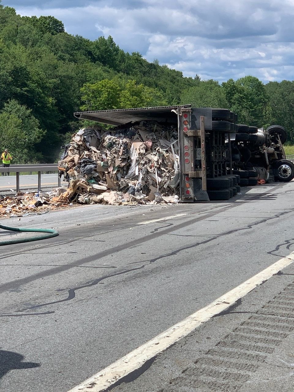 A tractor trailer overturned on State Route 17, causing debris and over 50 gallons of diesel fuel to spill the roadway.
