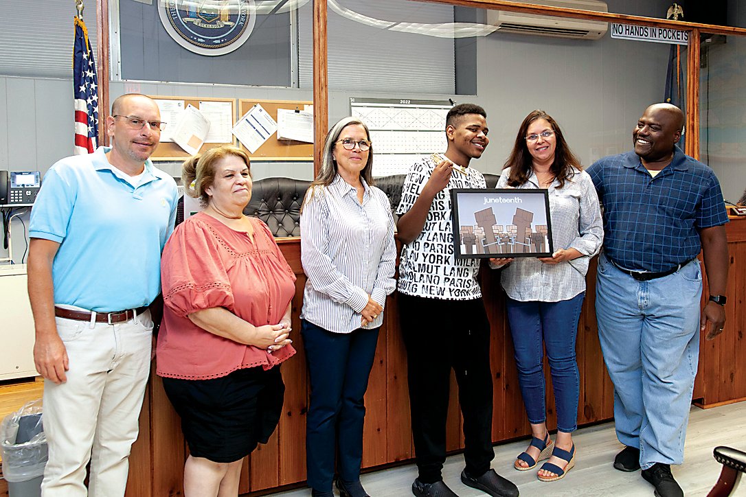 The Town of Fallsburg presented the first Key to the Town to Junior-Senior Fallsburg High School student Jacob Lawrence for his artwork commemorating and representing Juneteenth.  From the left, Town Council Member Joe Levner, Town Council Member Miranda Behan, Town Council Member Rebecca Pratt, Jacob Lawrence, Town Supervisor Katherine Rappaport and Town Council Member Sean Wall-Carty.