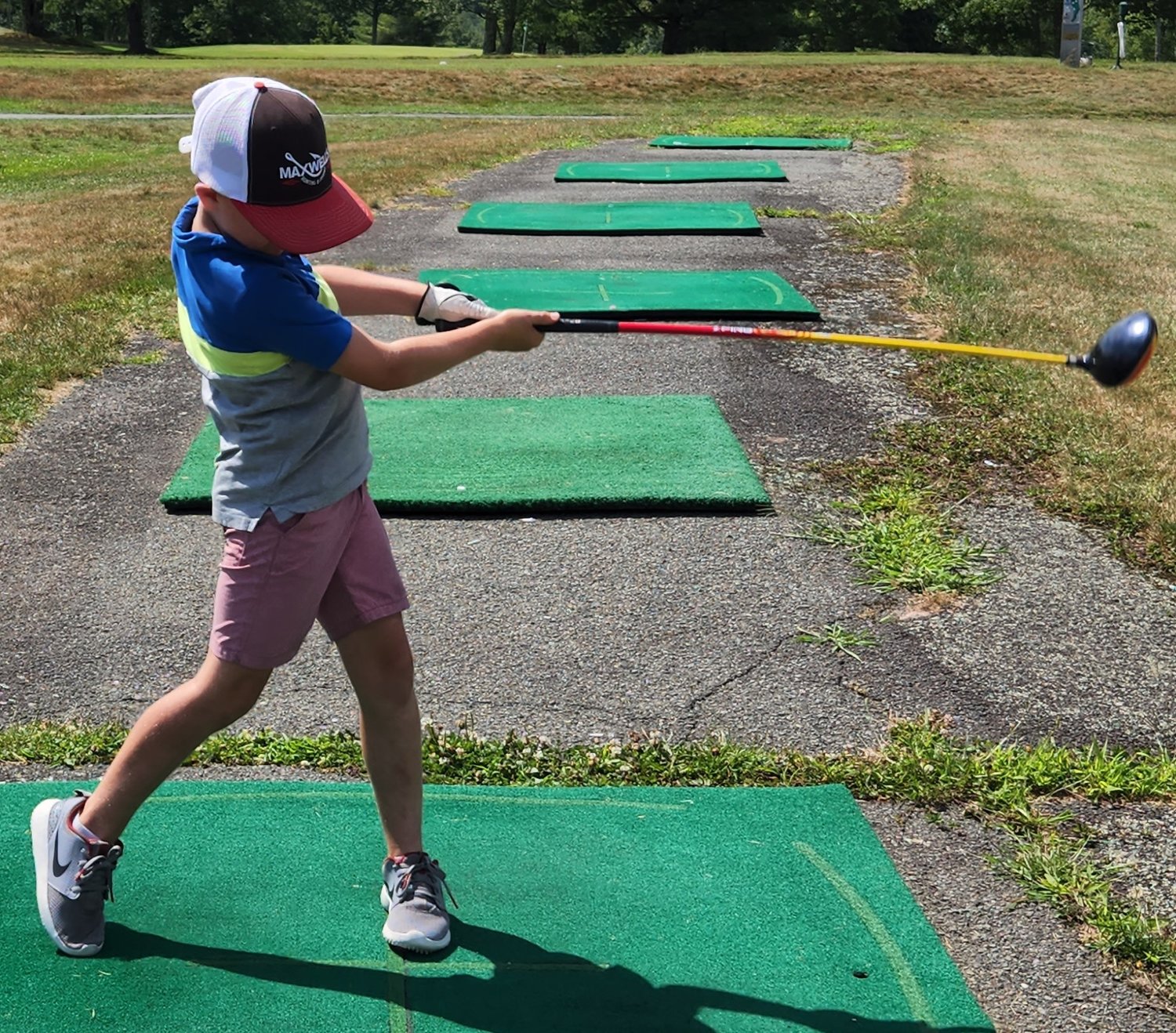 Golf camper Kevin Kubenik displays a nice swing at the recent Swan Lake Golf & Country Club junior golf camp.