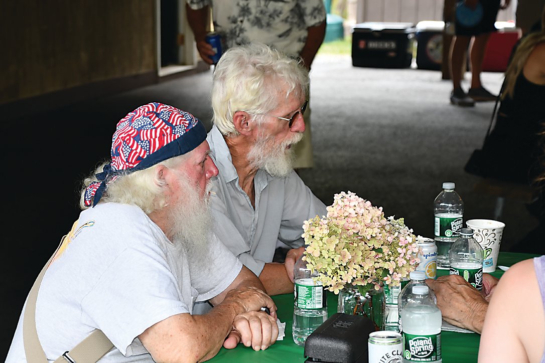 Zeke Boyle, right, and John Schumacher listen to a story about the good old days. Zeke is a lifelong resident of the Beechwoods and knew the whole Schumacher family growing up.