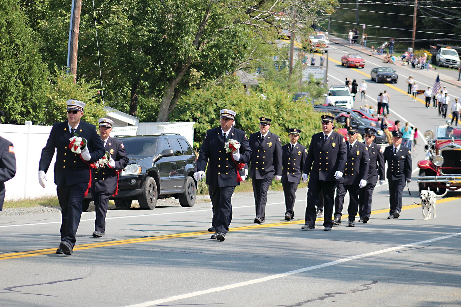 Members of the Liberty Fire Department march in Saturday’s parade.