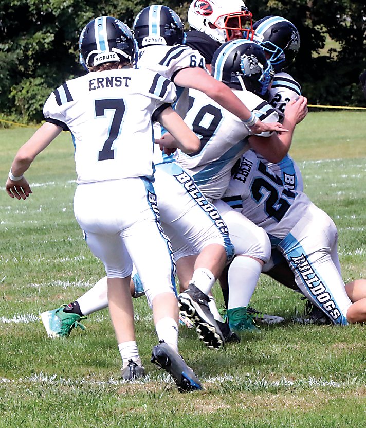 Bulldogs Max Ebert (25), Jakob Halloran (22), Dillan Hanslmaier (79), and Rodney Wilson (64) gang tackle Pawling running back Noah Holt as Adam Ernst (7) closes in to help. The ground defense was very effective in the game as was Pawling’s. A key stop by the Tigers on a SW fourth and 1 while the Bulldogs had the lead was a turning point in the game.
