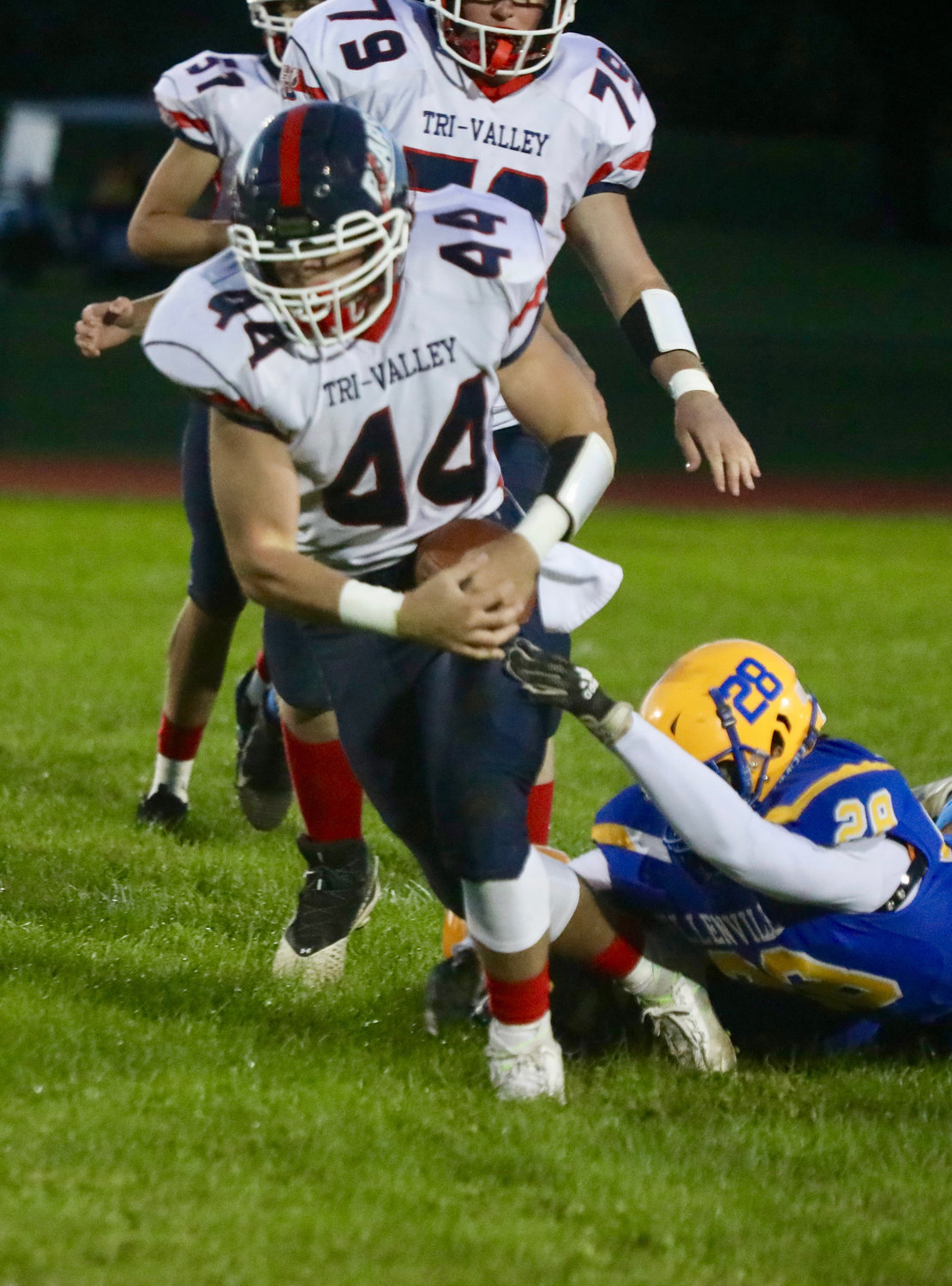 Tri-Valley senior running back Dylan Poley breaks a tackle and advances the ball up the field. Poley is not only a fierce runner, he is also a defensive standout.