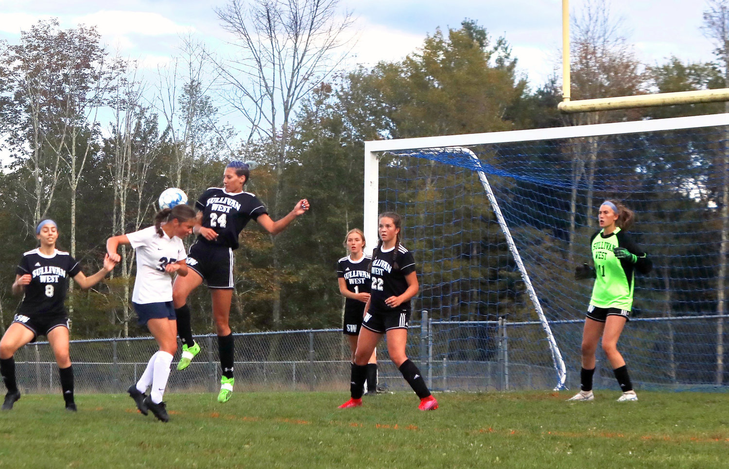 SW senior Anna Bernas proved her value in the game both offensively and defensively. She had the team’s lone goal in the second period. Here she rises to deflect a Burke shot on goal.