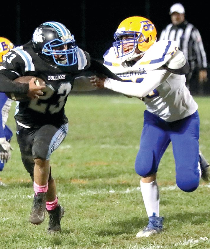 Sullivan West junior Rally Cruz had an evening of impressive runs that totaled over 100 yards. Here he seeks to elude a tackle by Ellenville’s Ryan Thompson.