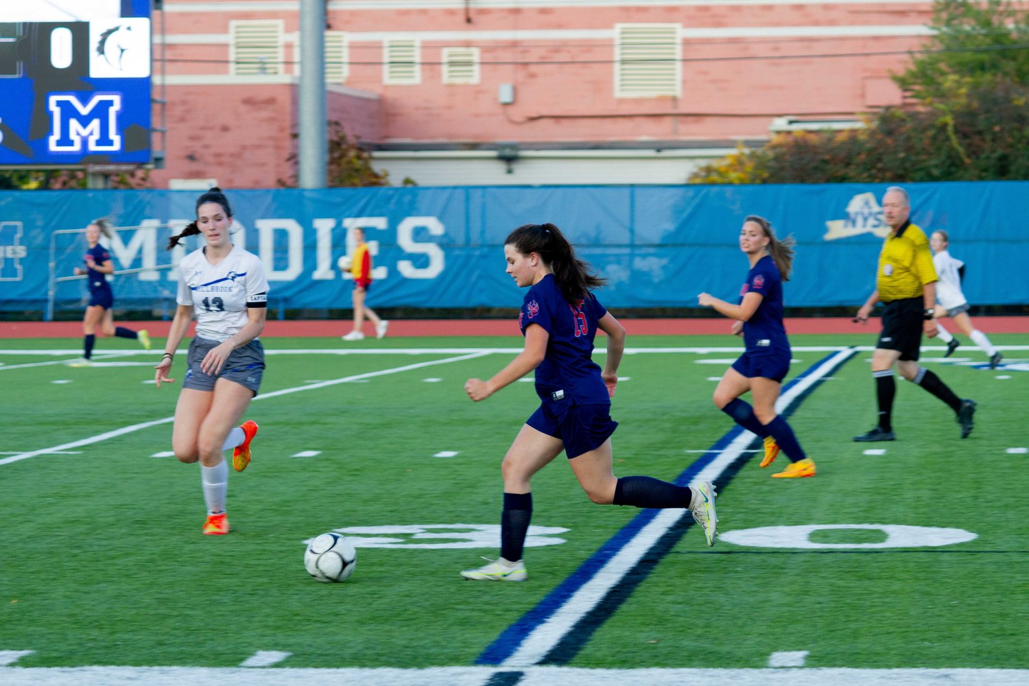 Midfielder Riley Kelly (15)  makes her way down the pitch during the Section IX Championship game.