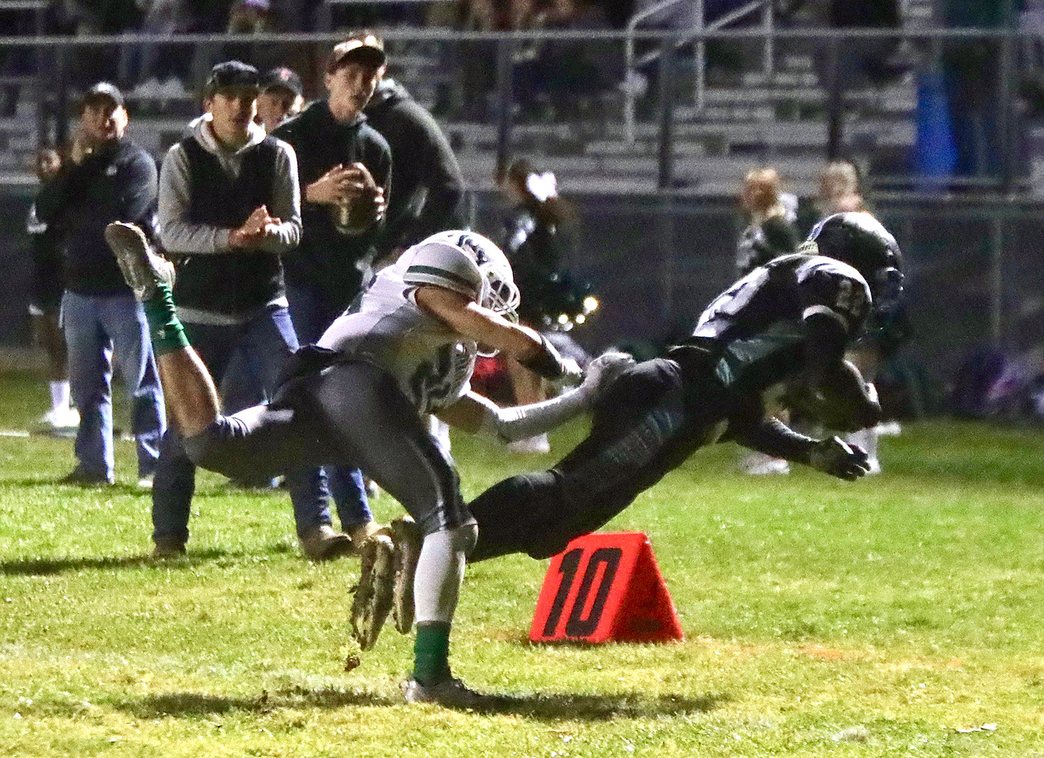 Sullivan West’s Jakob Halloran dives out of bounds after a great reception to avoid a tackle by Spackenkill defensive back Steven Ciancio. Halloran had a fine night receiving as well as on defense.