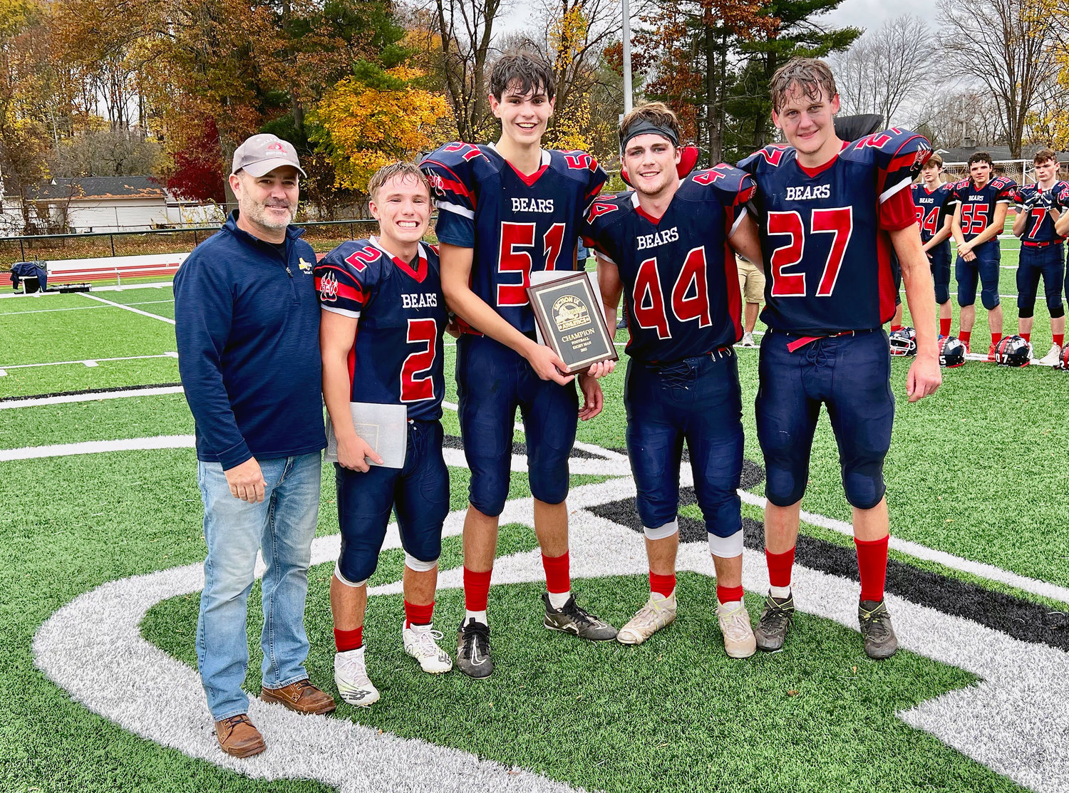 T-V Bears Austin Hartman, Collin Mentnech, Dylan Poley and Ian Mullen proudly hold the Section Nine trophy.