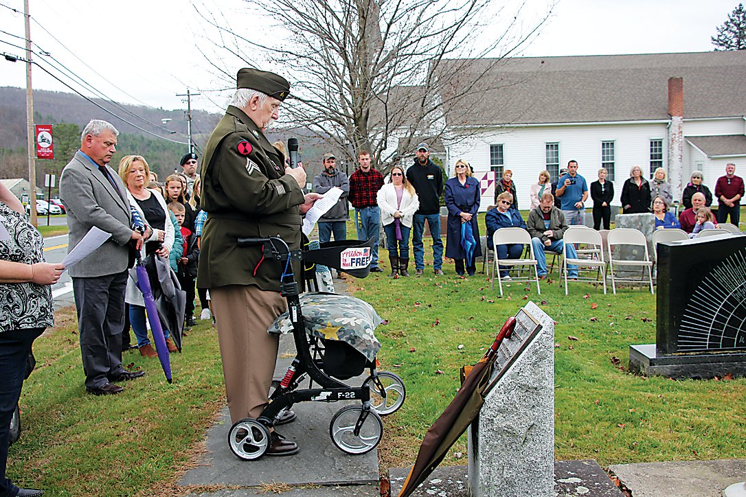 Vietnam Veteran and Purple Heart recipient James Richardson read a poem honoring the personal sacrifice of Veterans during the Flag Exchange on Friday.
