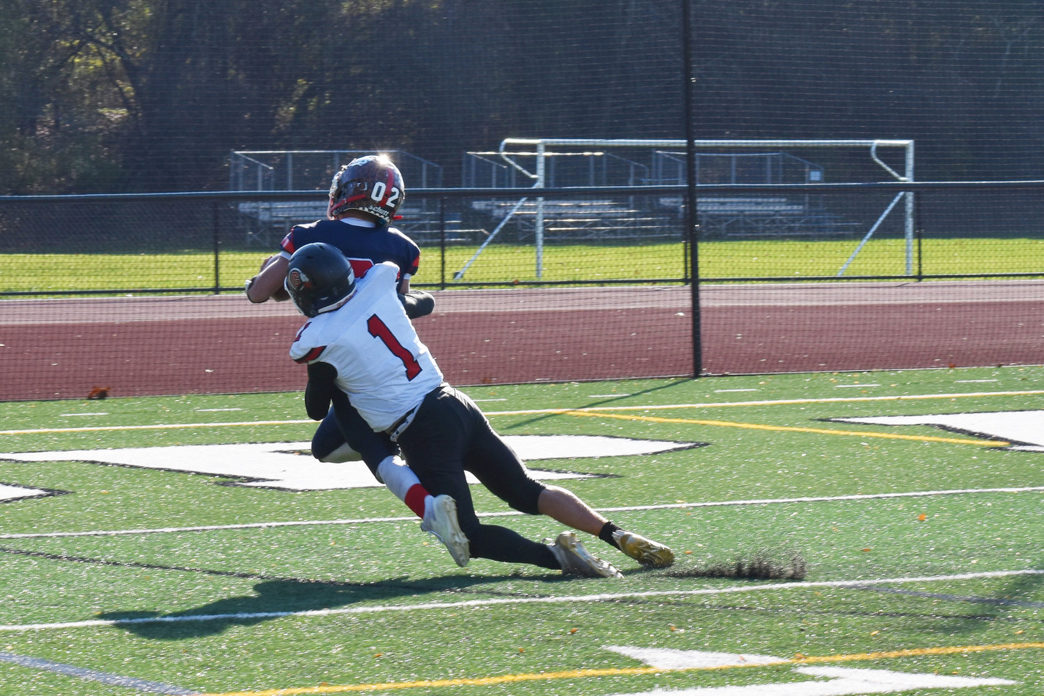 Austin Hartman, the shifty running Bears quarterback, broke away from the Groton defense for a 47-yard touchdown rush in the first quarter. It was his first of two touchdowns in the regional loss to the Indians.