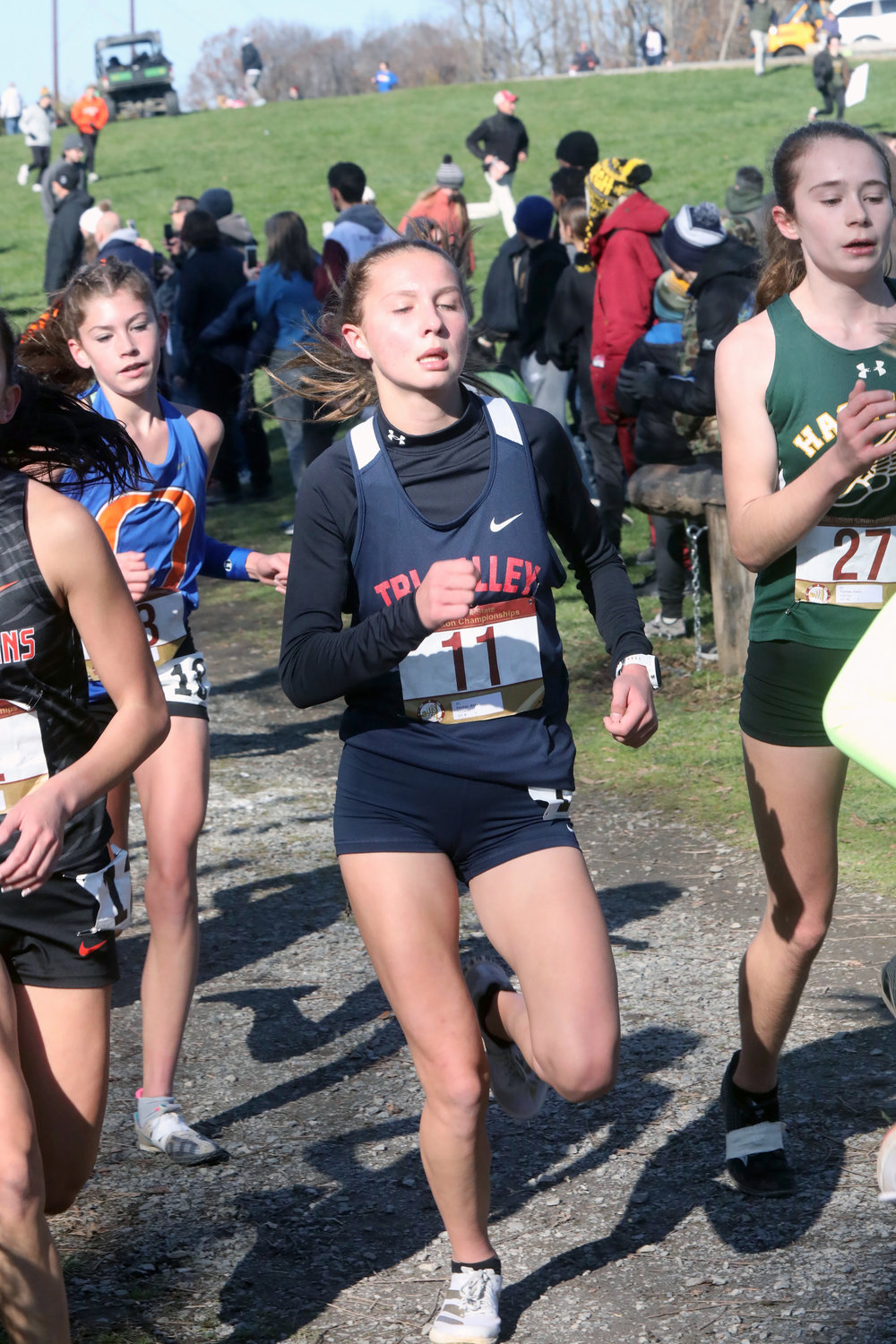 T-V eighth grader Anna Furman runs intensely with a half-mile to go in the Federation Championship. She finished 32nd out of 276 runners and earned a medal for her performance.