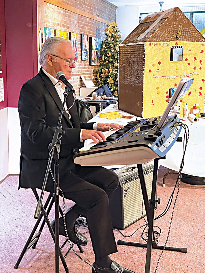 The Keyboard Wizard Walter Moylan provided a musical performance.