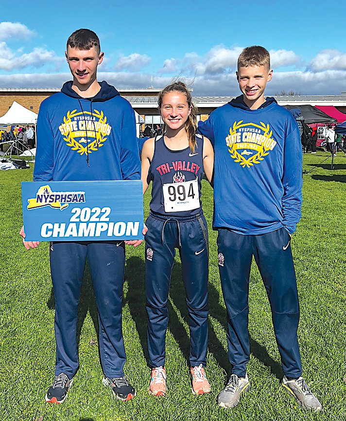 Adam, Anna and Van Furman bask in the glory of their state championship performances. Adam was first, Van and Anna finished second.