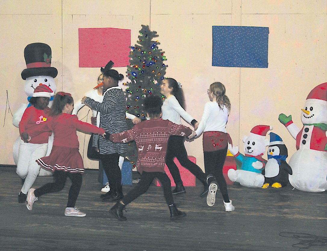 A skit was performed by the Liberty cheerleaders featuring some of the most famous Christmas carols and other holiday music.