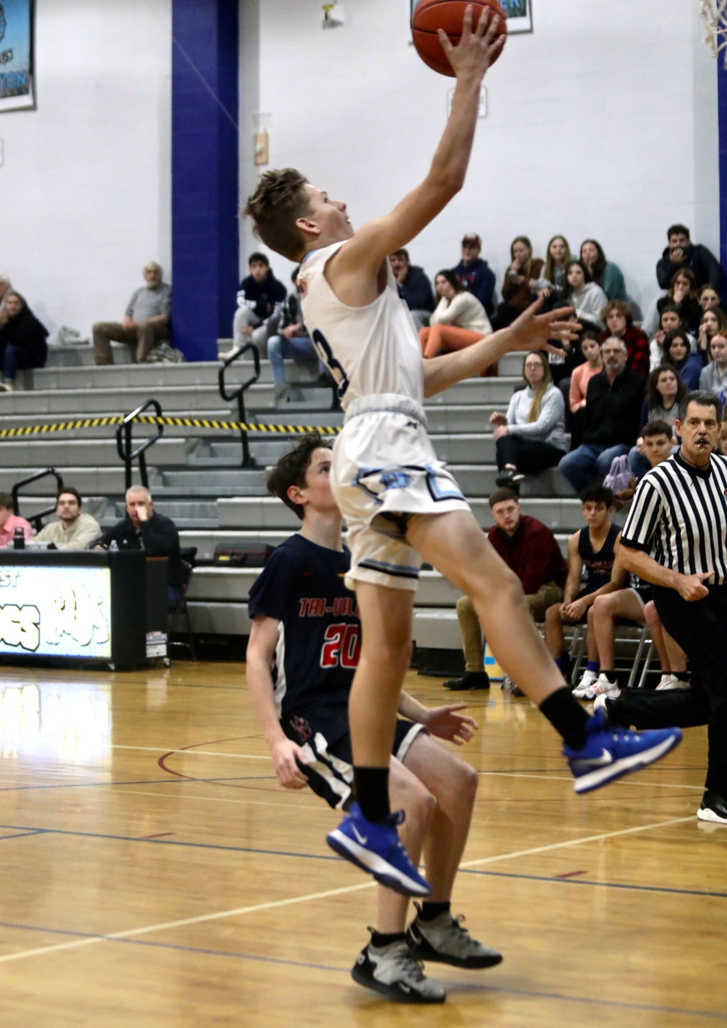 Sullivan West’s Evan Ebert goes aloft for two of his seven points in the Westies’ 39-37 league win over the Bears.