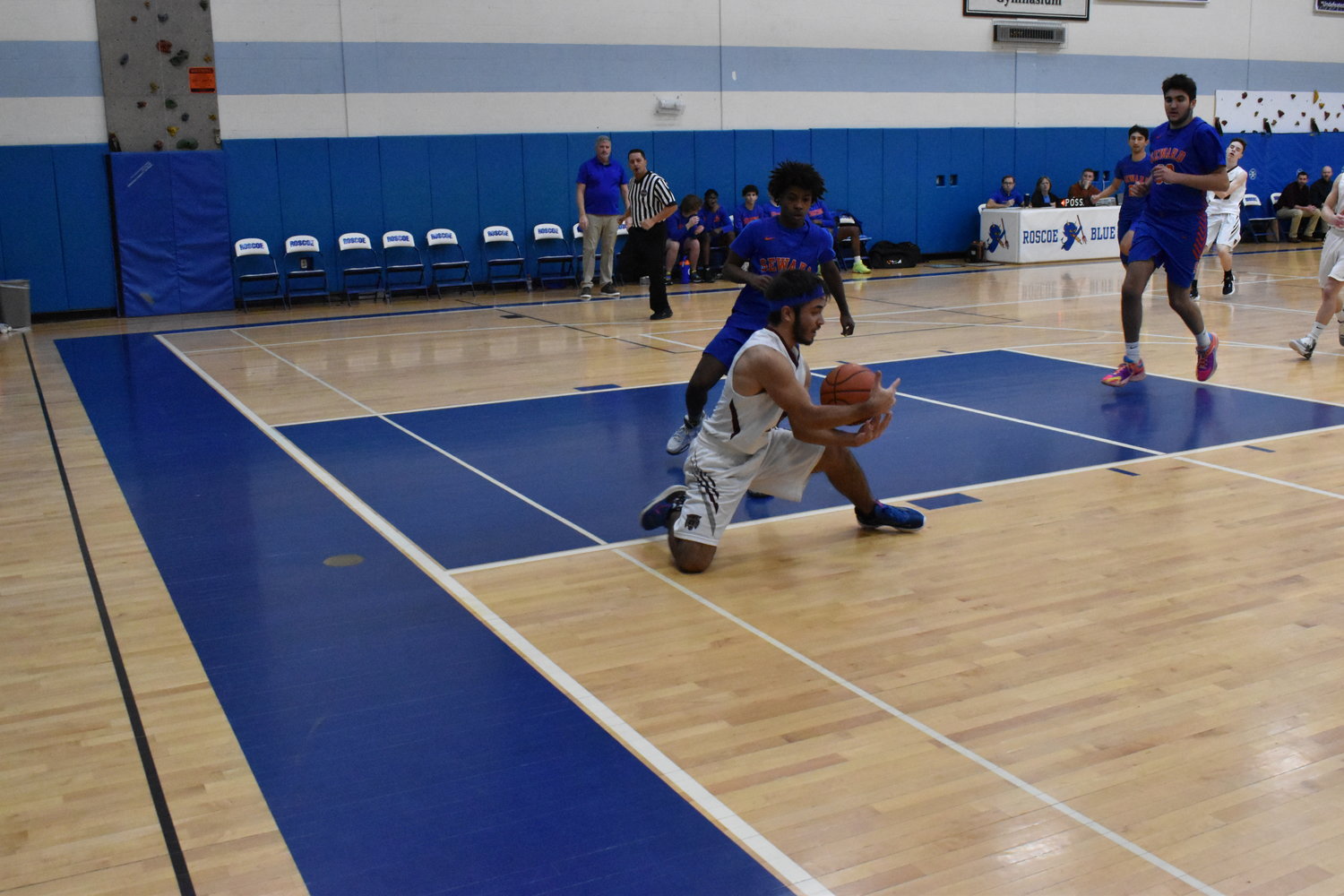Bobby Staudt hustles for a loose ball against Seward on Saturday afternoon.